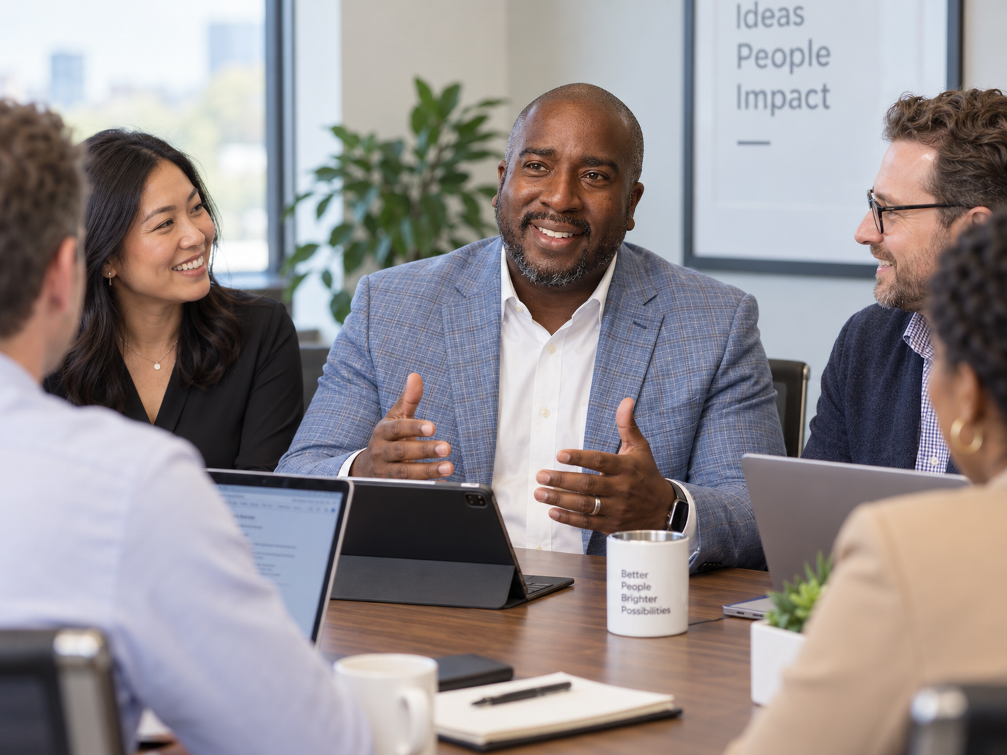 Shane Scott leading a thoughtful conversation around a conference table